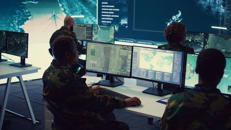 Army officer establishing new operating bases through a world map satellite vision, ensure the connectivity to the power base command center. Commander operates CCTV radar footage. Camera B.の写真素材