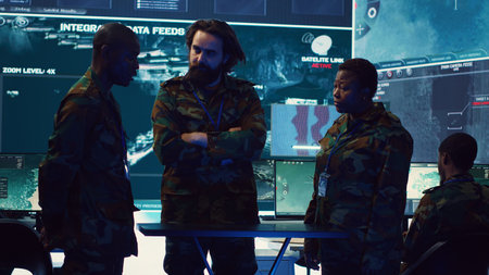 Brigadier general and his staff studying radar data on a holographic image, working with artificial intelligence and holography in a military base of operations. Ensure national safety. Camera A.の写真素材