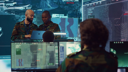 Army officers providing details for a new national safety mission, diverse team briefing their soldiers in a military base of operations. Specialists working with reconnaissance big data. Camera A.の写真素材