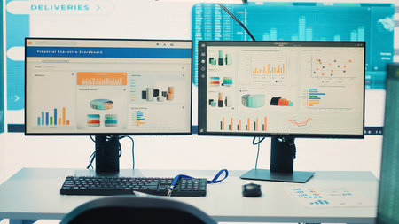 Empty business corporation workstations in a modern boardroom, office coworking space used in monitoring workflow and current firm situation. Big screen running important infographics. Camera A.の写真素材