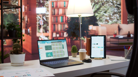 Empty business entrepreneur office setup at home with personal computer and documents showing...