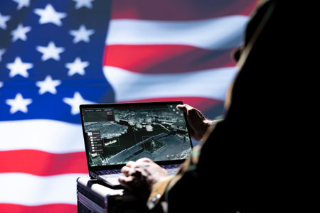 USA FBI agent combating organized crime and terrorism using detection system on laptop, close up shot. American officer protecting national sovereignty by tracking terrorists entering countryの写真素材