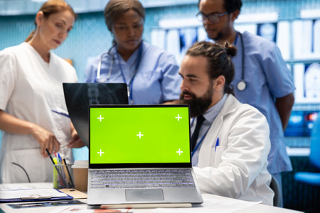 Diverse team of specialists examining radiography test scans with isolated screen in a meeting,...