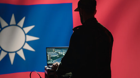 Communication systems operator working for Taiwanese freedom fighters uses radio and satellite equipment. Taiwan army unit manages broadcasting networks during territorial dispute with China, camera Aの写真素材