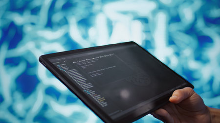 Software developer with tablet programming artificial intelligence computing simulating human brain. Close up of IT professional using device, building AI machine learning algorithms, camera Bの写真素材