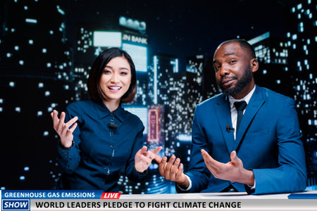 World leaders fighting climate change news on midnight talk show, diverse tv hosts talking about activists taking measures to reduce greenhouse gas emissions. Media journalists hosting live segment.の写真素材