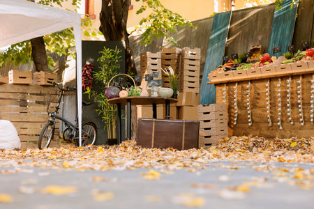 Vacant farmers market stand packed with locally grown, organic produce, including selection of vibrant fruits and vegetables. Farm produce stands containing seasonal goods and natural, nutritious foodの写真素材