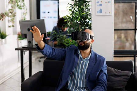 Entrepreneur using vr glasses for market research and analysis while working in business office....