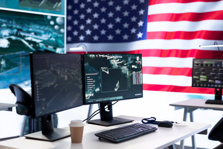 Empty monitoring room with an American flag protecting classified information and state secrets, army agency protecting the country with anti terrorism tactics. Military control center.の写真素材