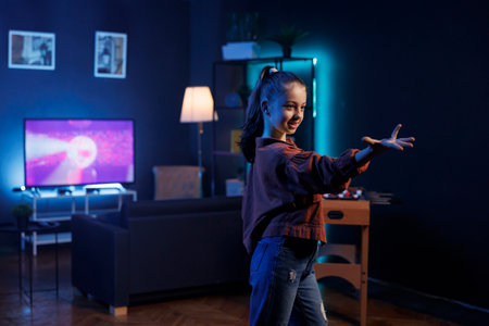 Content creator for children utilizing high quality recording equipment to produce dance videos for online streaming platforms. Youthful media sensation creating trending choreographyの写真素材
