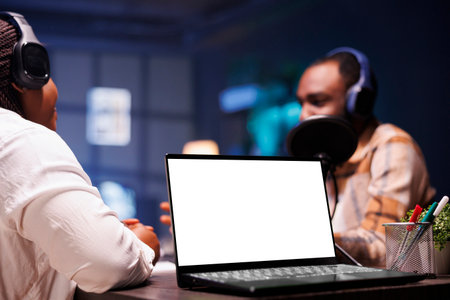 Detailed view of a laptop with blank chromakey copyspace display for talk show promotion. Close up...