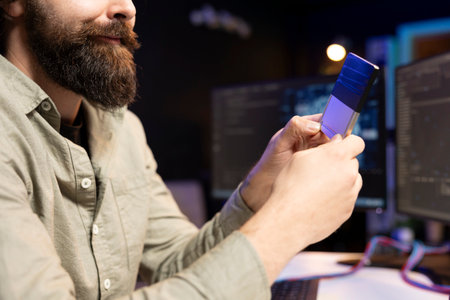 Programmer inserting disk into desktop PC containing data able to create sentient AI. Close up of IT expert placing cartridge in computer with machine learning awakening artificial intelligenceの写真素材