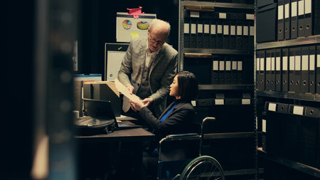 Forensic team extracting DNA samples for modern analysis in archive room, examining criminal evidence and compiles statistical data. Agent with disability working on private investigation. Camera B.の写真素材