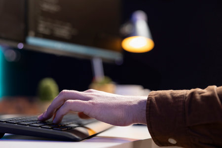 Programmer implementing and maintaining security measures to protect company systems and data. Admin writing, testing and debugging Java code for web and mobile applications, close upの写真素材