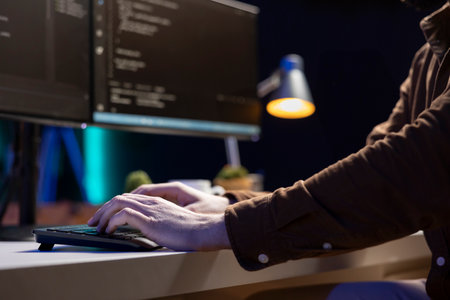 Computer scientist typing on keyboard, implementing security measures to protect company systems and...