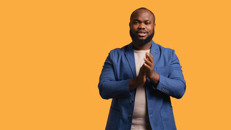Approving joyful african american man happily clapping hands, ecstatic about accomplishments....