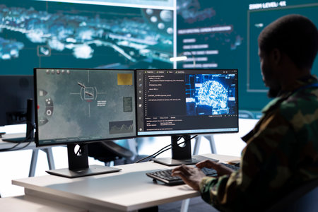 Soldier working with AI intelligence on pc in control room, processing live data on cctv satellite systems. Surveillance efforts to support field missions and defense operations, national security.の写真素材