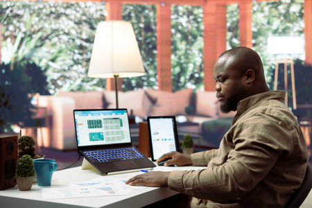 Executive officer reviewing infographics on sales invoices to evaluate supply and demand, exploring...