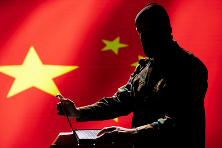 Masked technician making bot accounts spreading false news online meant to criticize powers. Developer working for intelligence corps coding troll farmの写真素材