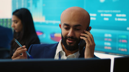 Business analyst does a presentation with project updates on phone call, discussing with CEO to ensure organizational success. Employee allocating resources according to the market needs. Camera A.の写真素材