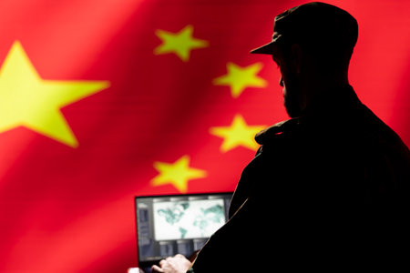 Chinese Air and Space Force unit responsible for China air defense, relaying instructions to squadrons patrolling over borders. CCP government military specialist uses laptop software to do monitoringの写真素材
