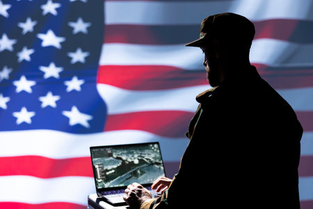 Agent using radar system on laptop to detect incoming ballistic missiles. NATO army soldier scanning rockets approaching borders, deploying shields, United States flagの写真素材