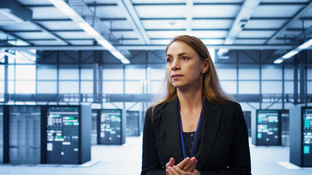 Manager inspecting server room equipment, walking between supercomputers. Supervisor doing...