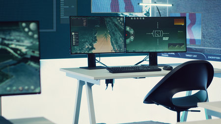 Government army headquarters monitoring room with big screen examining satellite footage for threat...