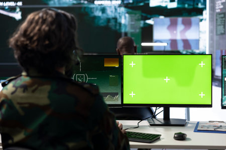 Professional IT engineer monitors radar footage and copy space, working with national CCTV real time data for defense operation. Serviceman helping with national safety in power base.の写真素材