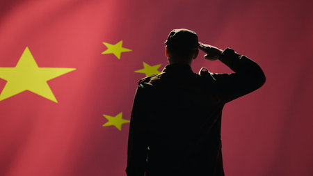Member of army doing saluting hand gesture towards China flag in command center, showing respect. Military unit in uniform serving, doing honoring gesturing, camera Bの写真素材