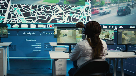 Cargo shipping agency employees operating on city satellite map to communicate the best routes for...