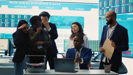 Displeased project manager sharing the failure with his team, employees feeling disappointed and frustrated about unsuccessful partnership. Furious CEO and dissatisfied associates. Camera A.の写真素材