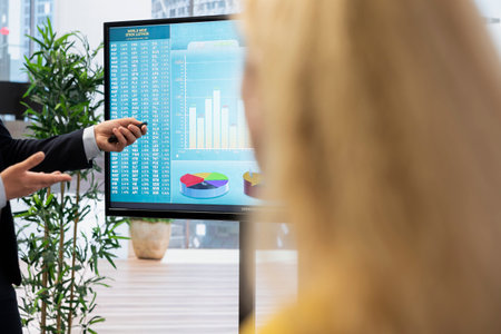 Financial advisor discussing with clients, recommending suitable financial products such as mutual...