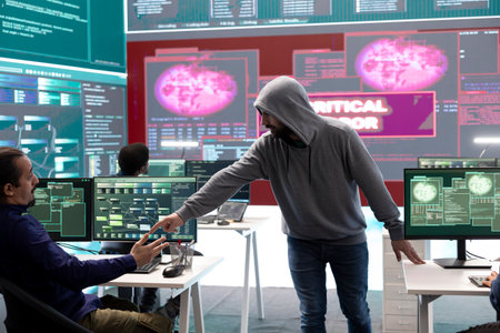 IT specialists receiving error messages on a big screen after trying to hack a government system,...