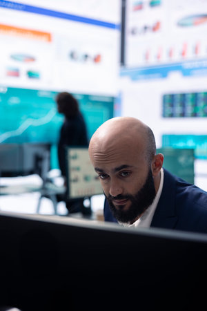 Accounting manager reviewing budget numbers after monthly costs, working on a financial projection to deduct the future enterprise situation. Business analyst does a financial study.の写真素材