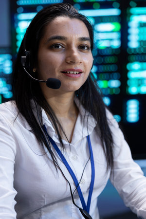 Upbeat supervisor in data center providing support for customers, troubleshooting malfunctions....