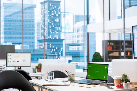 Empty insurance agency modern office with a green screen on laptop, space used for counseling meetings to help customers with retirement planning. Secure financial options.の写真素材
