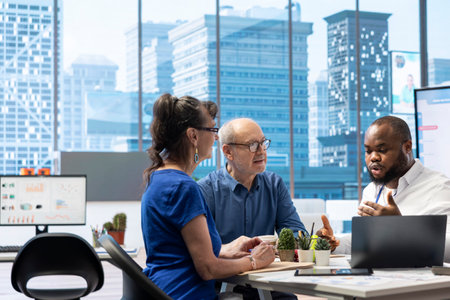 Elderly people meeting with a financial planner to develop a retirement strategy with life savings and income to cover future expenses. Establishing investment plans for long term financial goals.の写真素材