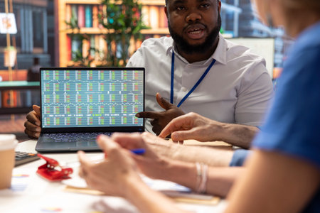 Old people exploring variety of retirement plan options with financial broker, life savings. Senior clients consulting a planner to secure a pension for future stability.の写真素材