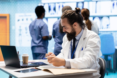 Professional doctor writing a prescription treatment plan in his cabinet, recommending medicine for disease prevention. Specialist expert consulting analytics and healthcare records in a facility.の写真素材