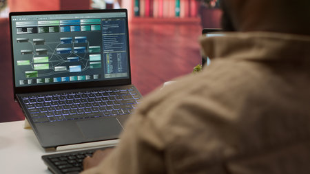 Professional software developer at desk working on AI coding and machine learning projects, showcasing innovation in software development and digital business. Internet of things. Camera A.の写真素材