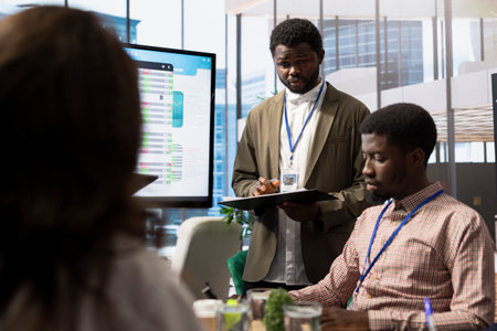 Office administrator exploring collaborations opportunities for their business, establishing current enterprise objectives with the work team. Forecast affiliates are doing a win or loss study.の写真素材