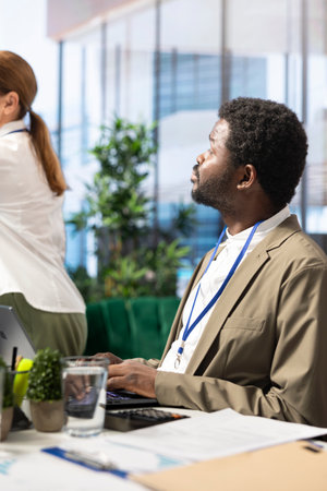 Advisory board members and team leaders gathering to review project outcomes, discuss resource allocation to ensure objectives achievement. Diverse business associates in a meeting.の写真素材