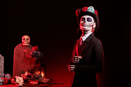 Portrait of smiling lady with hat at religious processions during Dia de los Muertos november...