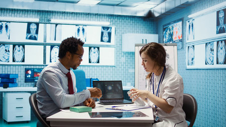 Doctor giving woman a pill from the medicine tablet to start treatment with antibiotics,...