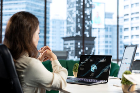 Forecast expert CEO analyzing investment insights and negotiations details, looking at data analytics and reports to establish the corporation vision and objectives. Business productivity.の写真素材