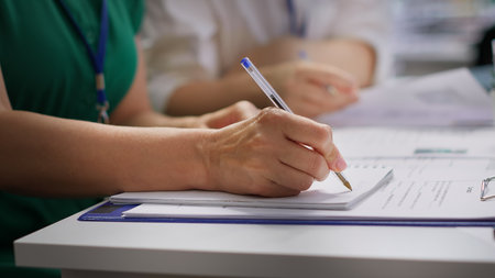 HR recruiters interviewing a job seeker and taking notes during meeting, attending an interview and...
