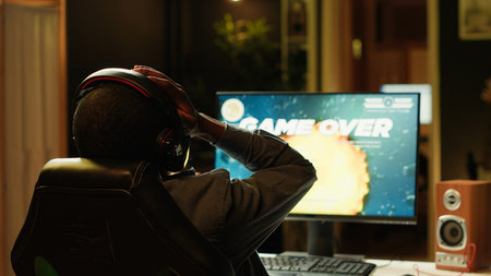 Heartbroken gamer dejected after losing in online multiplayer videogame, being defeated by rivals....
