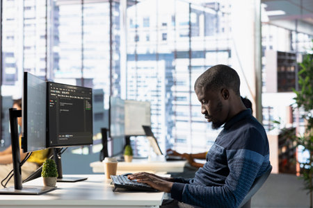 Computer technician doing software quality assurance, reading source code on computer before implementing it. IT admin inspecting coding on PC device, looking to fix potential issuesの写真素材