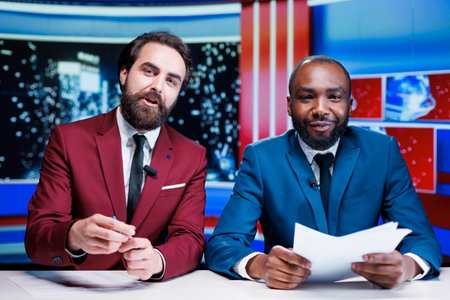 Diverse journalists live on talk show, broadcasting latest breaking news with exclusive details and...